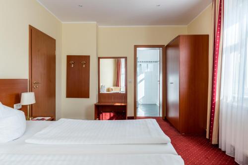 Letto o letti in una camera di Andante Hotel Dresden