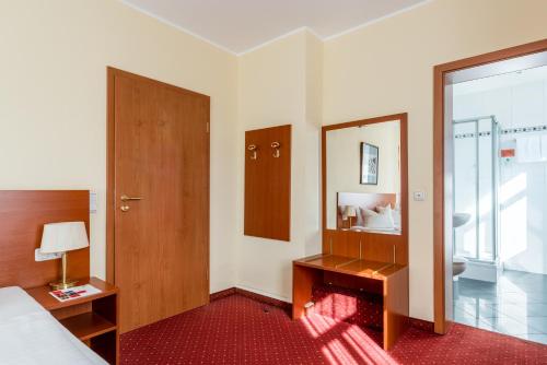Letto o letti in una camera di Andante Hotel Dresden