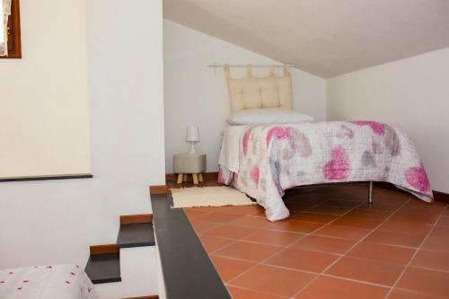 Postel nebo postele na pokoji v ubytování Casa Vacanze Tra Le Mura