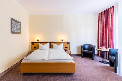 Letto o letti in una camera di Andante Hotel Dresden