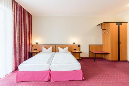 Letto o letti in una camera di Andante Hotel Dresden