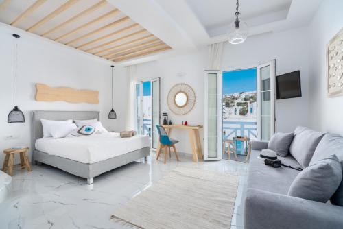 Posteľ alebo postele v izbe v ubytovaní Central Suites Mykonos