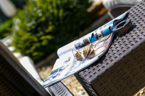 a couple of pamphlets sitting on top of a bench at Apartments Petra Krk in Krk