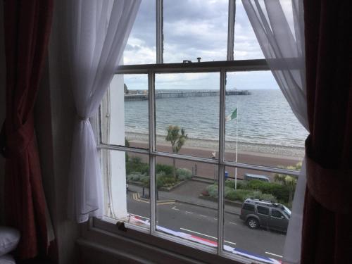 a window view of the ocean from a hotel room at THE TREVONE, Llandudno in Llandudno