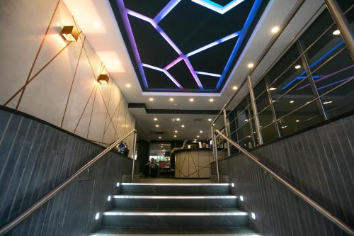 a staircase with a blue and purple ceiling at Best Western Plus Nottingham City Centre in Nottingham