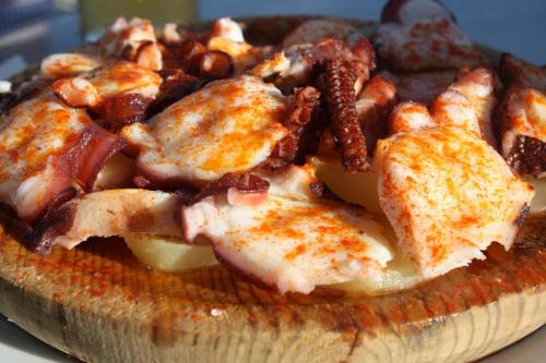 a close up of a plate of food on a table at Hotel A Queimada in Nigrán