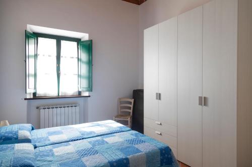 Postel nebo postele na pokoji v ubytování Appartamento Napoleone - HelloElba