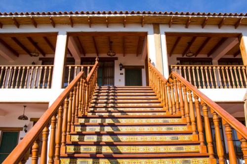 a set of stairs leading up to a house at Casa Hacienda Nasca Oasis in Nazca