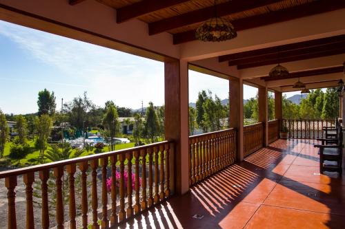 a porch with a view of a parking lot at Casa Hacienda Nasca Oasis in Nazca