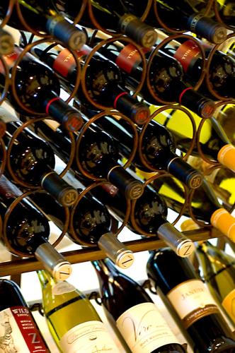 a bunch of bottles of wine in a rack at Majestic Inn and Spa in Anacortes