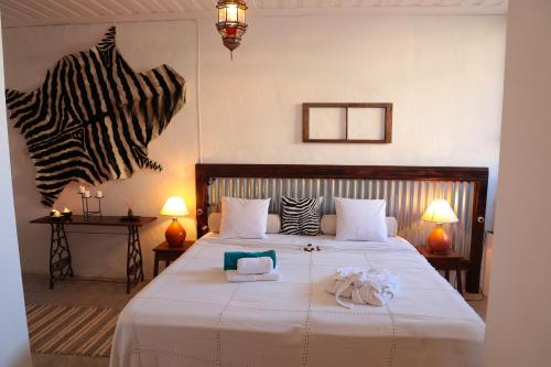 En eller flere senge i et værelse på Casa Colonial Koenig
