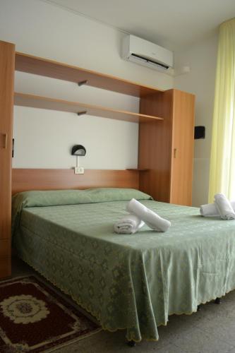 Postel nebo postele na pokoji v ubytování Hotel Mirage