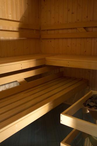 a wooden sauna with wooden shelves in it at Penzion u Veselých in Pec pod Sněžkou