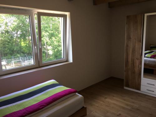 Postel nebo postele na pokoji v ubytování Pferd