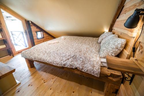 Una cama o camas en una habitación de Apartment with Sauna pr' Geči