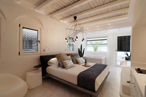 A bed or beds in a room at Narcissus Luxury Suites