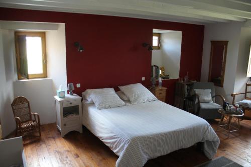 En eller flere senge i et værelse på Manoir de la Ventinière
