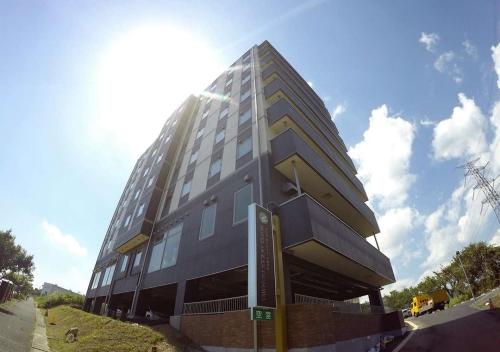 a tall building on the side of a street at Hotel Ocean Iwasawa / Vacation STAY 33555 in Kido