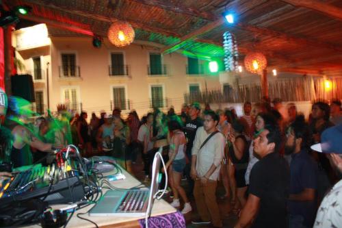 a large group of people standing in a room at Wabi Hostel in Playa del Carmen