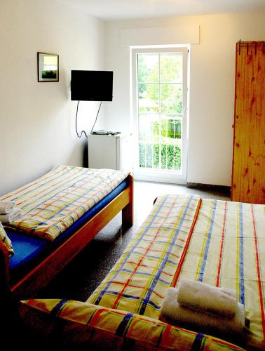 Postel nebo postele na pokoji v ubytování Ferienhaus Roy