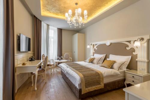 Posteľ alebo postele v izbe v ubytovaní Royal Piazza