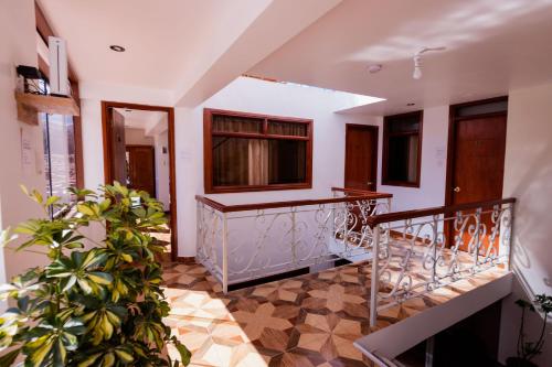 a staircase in a house with plants at Cozy Room Cusco in Cusco