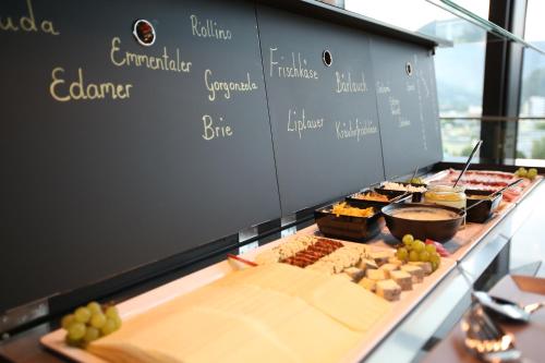 a buffet with many different types of food on display at arte Hotel Salzburg in Salzburg