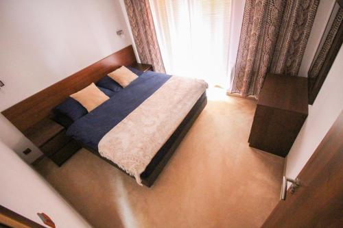 Ένα ή περισσότερα κρεβάτια σε δωμάτιο στο Tatragolf Apartment B407