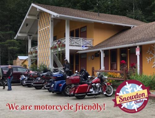 a row of motorcycles parked outside of a house at Snowdon Chalet Motel in Londonderry