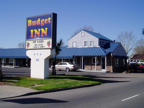a sign for a burger inn in front of a building at Budget Inn of Lodi in Lodi