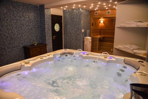 a jacuzzi tub in a hotel room at Padam Hotel & SPA in Ulcinj