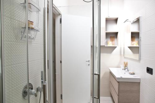 a bathroom with a shower and a sink at Borgo12 in Pimonte