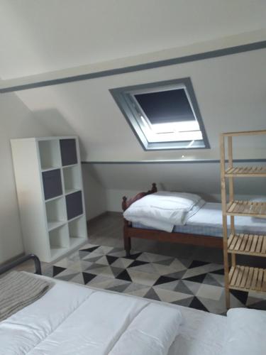 Voodi või voodid majutusasutuse Appartement La Nacre vue mer éloignée toas
