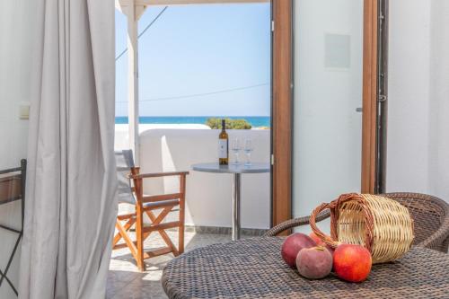 a table with a basket of fruit on top of it at Studio Tolakis in Plaka