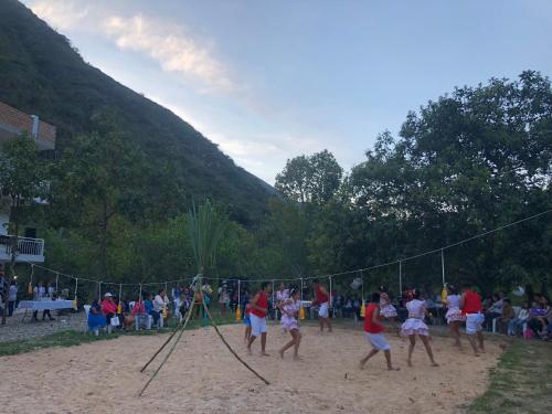 a group of people playing a game in the sand at Zoila's Suite Escape in Nuevo Tingo