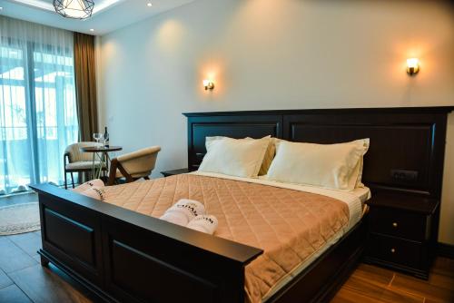 a bedroom with a large bed in a room at Padam Hotel & SPA in Ulcinj