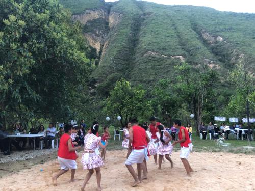 a group of people playing a game of soccer at Zoila's Suite Escape in Nuevo Tingo