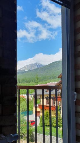 a view of a mountain from a window at Apartmán Sofia s infrasaunou, PRIMO, Starý Smokovec in Smokovce