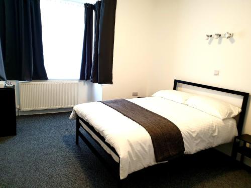 Wanstead Hotelにあるベッド