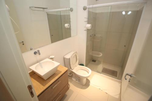 a bathroom with a sink and a toilet and a shower at Hotel da Praça in Bonito