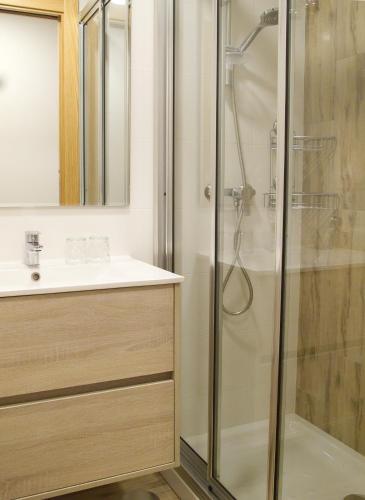 a bathroom with a shower and a sink at Hostal La Provinciana in A Coruña