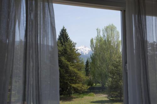 a view of a mountain from a window at Valemount Vacation Inn in Valemount