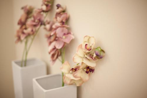 a group of pink flowers in a white vase at Sofie Apartments in Vienna