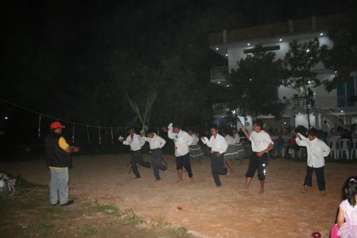 a group of men in white shirts are dancing at Zoila's Suite Escape in Nuevo Tingo