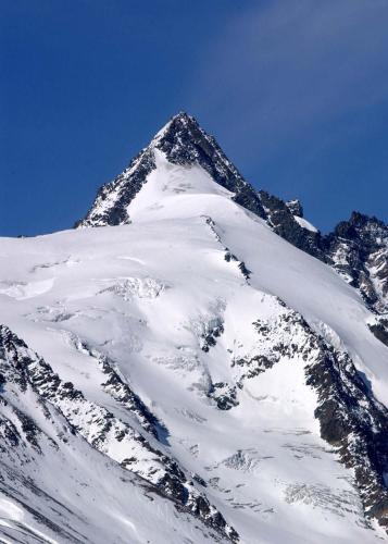 a mountain covered in snow with a blue sky at Hotel Oberwirt - nahe an Saalbach und Zell am See, Viehhofen Sommercard in Viehhofen