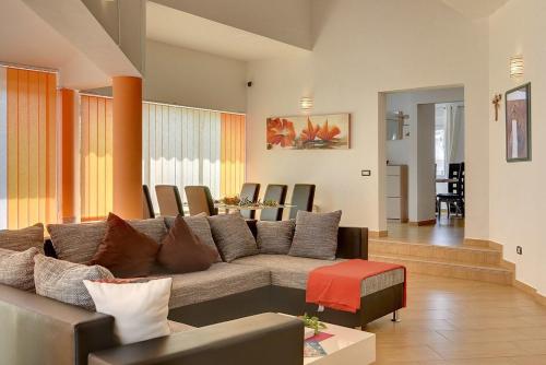 a living room with a couch and a table at Villa Marcelia in Pula