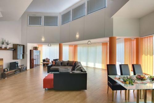 a living room with a couch and a table at Villa Marcelia in Pula