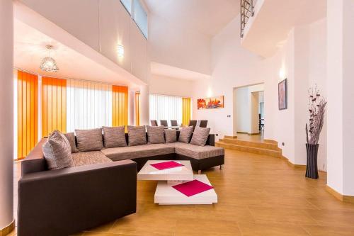 a living room with a couch and a table at Villa Marcelia in Pula