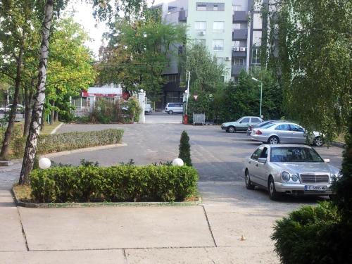 a car parked in a parking lot with cars at Hostel Elena in Sofia