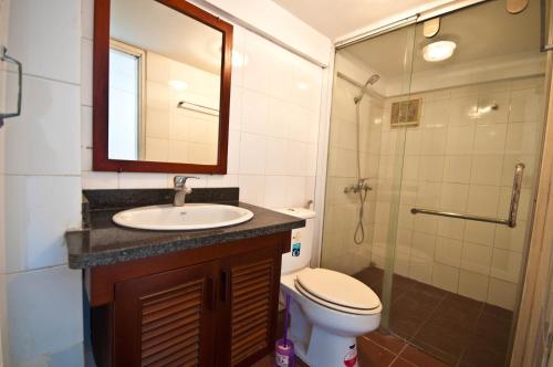 a bathroom with a sink and a toilet and a shower at Davidduc 224 Âu Cơ in Hanoi